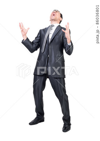 Businessman in suit shouting in studio. White background. Businessman in suit shouting in studio. White background. 86036801