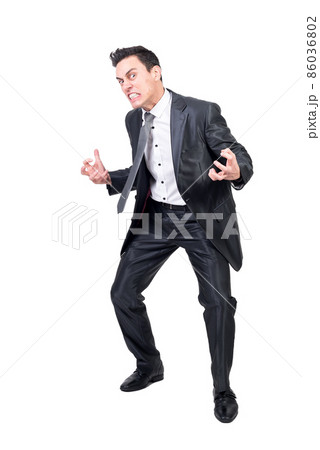Crazy businessman in suit in studio. White background. 86036802