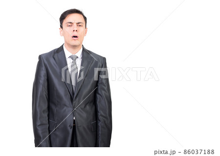 Half asleep man in formal wear in studio 86037188