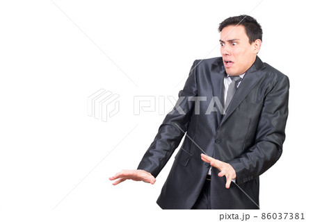 Scared young guy in horror looking away in studio 86037381