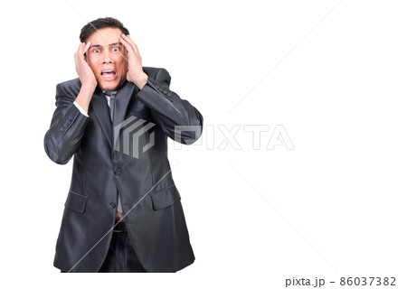 Scared man touching head and looking at camera 86037382