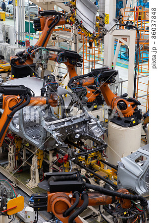 Vertical photo of automobile production line. Modern car assembly plant. Auto industry. Interior of 86037848
