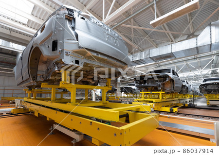 Car bodies are on assembly line. Factory for production of cars. Modern automotive industry. A car Car bodies are on assembly line. Factory for production of cars. Modern automotive industry. A car 86037914