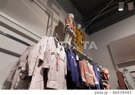 showcase with clothes in a store clothes for children and adults showcase with clothes in a store clothes for children and adults 86038485