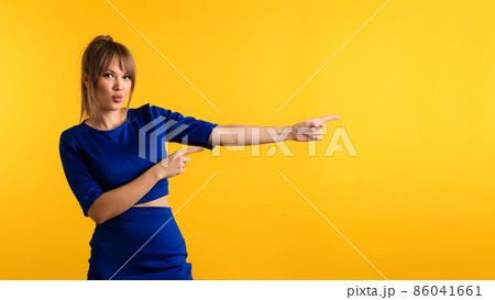 Woman pointing index fingers Woman pointing index fingers 86041661