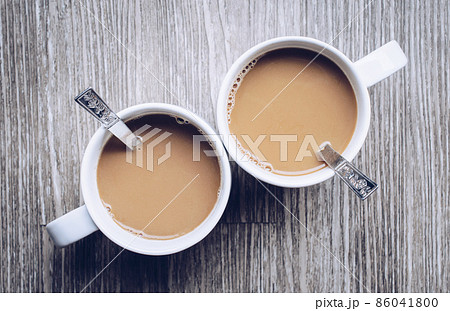 Couple cup of hot instant coffee on the wooden table. 86041800