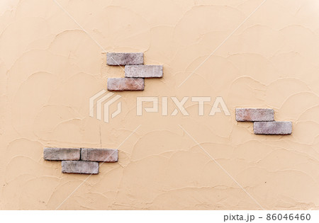 テクスチャ素材=明るいオレンジ色の塗り壁と煉瓦 86046460