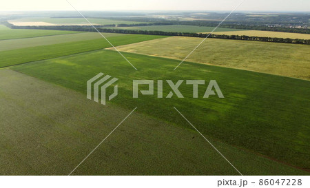 Aerial drone view flight over different agricultural fields 86047228