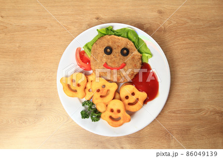 delicious schnitzel and garnish on a dish in children's restau delicious schnitzel and garnish on a dish in children's restau 86049139