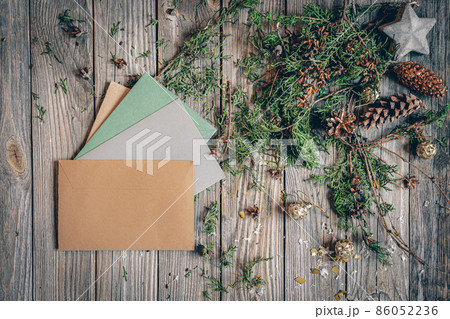 Flat lay Christmas composition with letters on a wooden surface. 86052236