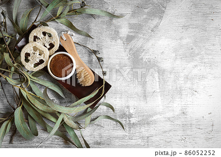 Flat lay spa composition with body products on textured concrete background. 86052252