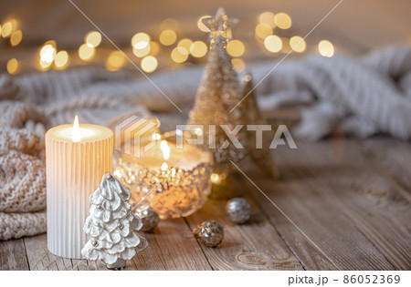 Christmas background with burning candle and decor details. 86052369