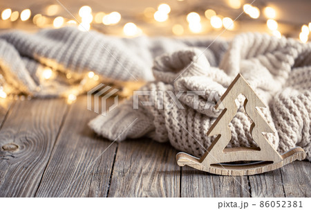 Christmas composition with wooden decorative element on blurred background. 86052381