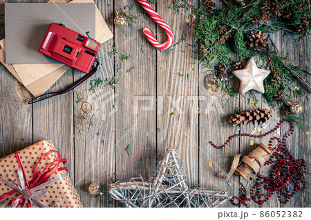 Christmas flat lay background on wooden surface, copy space. Christmas flat lay background on wooden surface, copy space. 86052382