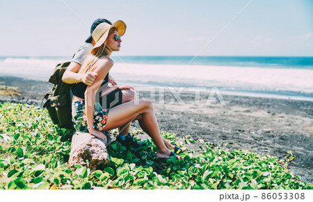 Couple enjoying waving sea on summer holidays Couple enjoying waving sea on summer holidays 86053308