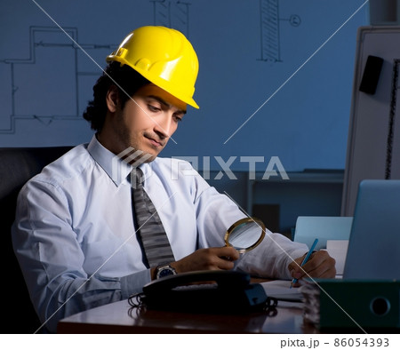 The young construction architect working on project at night The young construction architect working on project at night 86054393