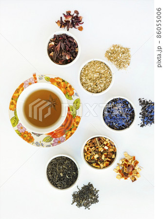 Natural herbal tea of different varieties. Variety of dry tea in utensils, close up. 86055006