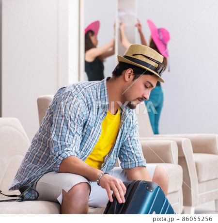 Young family packing for vacation travel Young family packing for vacation travel 86055256