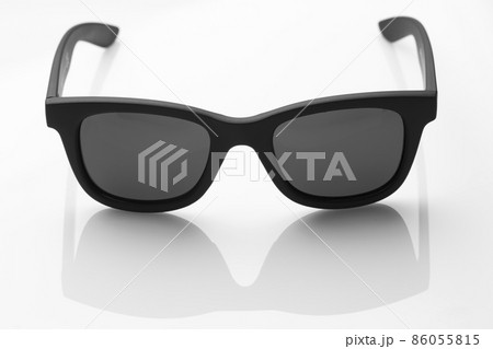 Sunglasses in a black frame on a white background. 86055815