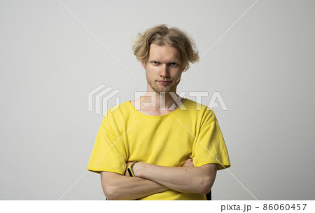 Closeup portrait of skeptical man looking suspicious, some disgust on his face mixed with disapproval isolated on gray background. Negative human emotions, facial expressions, feelings. Closeup portrait of skeptical man looking suspicious, some disgust on his face mixed with disapproval isolated on gray background. Negative human emotions, facial expressions, feelings. 86060457