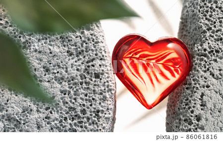 red glass heart between gray rock stones banner red glass heart between gray rock stones banner 86061816