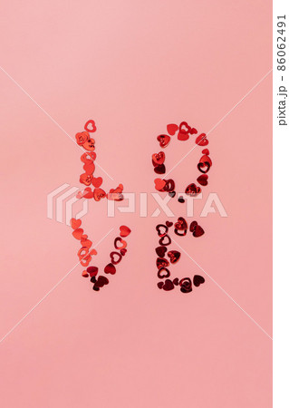 Valentines, love and wedding concept. Lettering love on pink background. Flat lay, top view. Valentines, love and wedding concept. Lettering love on pink background. Flat lay, top view. 86062491