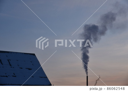 Pipe with smoke in the evening with sunset Pipe with smoke in the evening with sunset 86062548