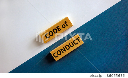 Code of conduct symbol. Concept words 'Code of conduct' on wooden blocks on a beautiful white and blue background. Business and code of conduct concept. Copy space. Code of conduct symbol. Concept words 'Code of conduct' on wooden blocks on a beautiful white and blue background. Business and code of conduct concept. Copy space. 86065636
