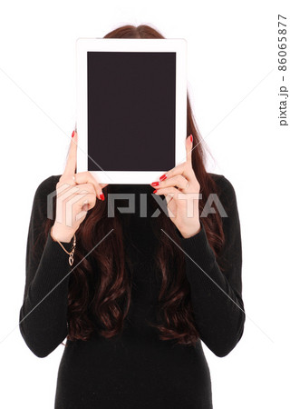Girl keeps tablet pc the face Girl keeps tablet pc the face 86065877