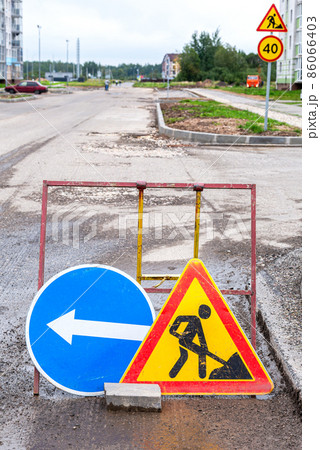 Road works traffic sign at the city street Road works traffic sign at the city street 86066403