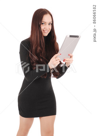 Girl in movement holds tablet computer Girl in movement holds tablet computer 86066582