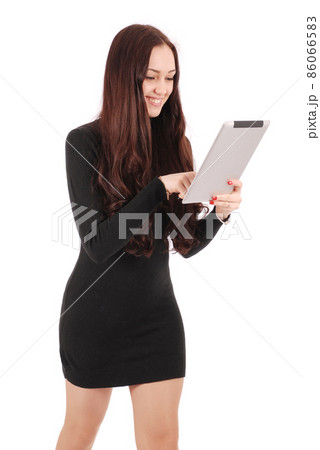 Girl in movement looking at tablet computer 86066583