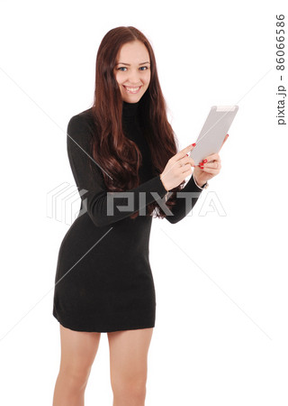 Girl in movement holds tablet computer Girl in movement holds tablet computer 86066586