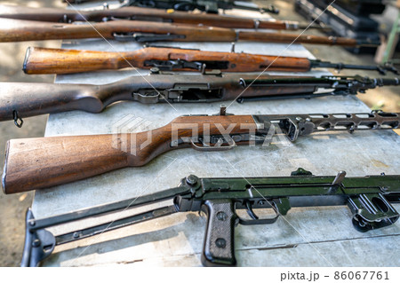 collection of historical and modern weapons on the shooting range collection of historical and modern weapons on the shooting range 86067761