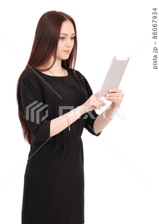 Happy student teenage girl keeps tablet pc standing sideways 86067934