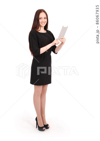 Happy student teenage girl keeps tablet pc standing sideways 86067935