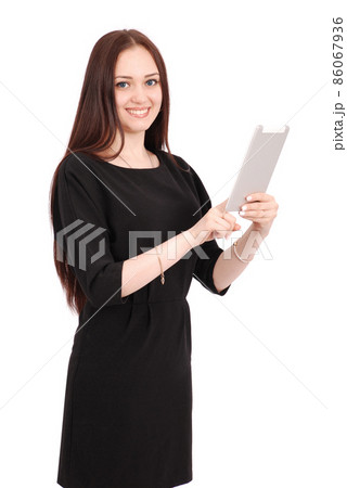 Happy student teenage girl keeps tablet pc standing sideways 86067936