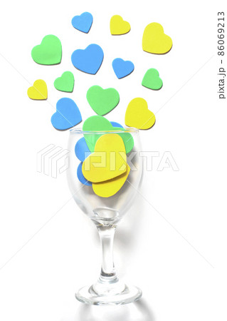 Valentine's Day background. Multi-colored hearts in a glass, isolated in white 86069213