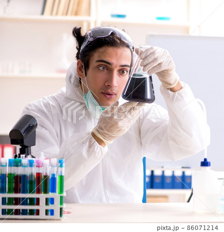 The young handsome chemist working in the lab The young handsome chemist working in the lab 86071214