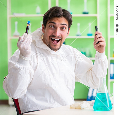 Chemist working in the lab on new experiment Chemist working in the lab on new experiment 86072731