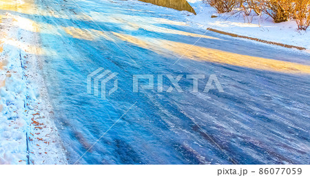 The icy road in winter at Vilnius, Lithuania. 86077059
