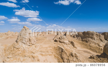 Aerial view of landscape in desert under blue sky 86078956