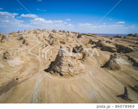 Aerial view of landscape in desert under blue sky 86078969