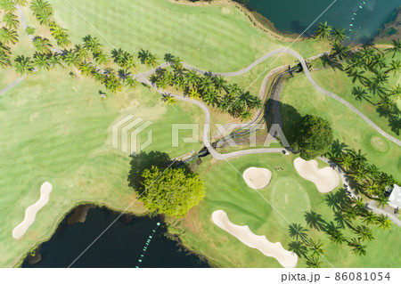 Aerial view of the green golf course in Thailand Beautiful green grass and trees on a golf field with fairway and putting green in summer season 86081054
