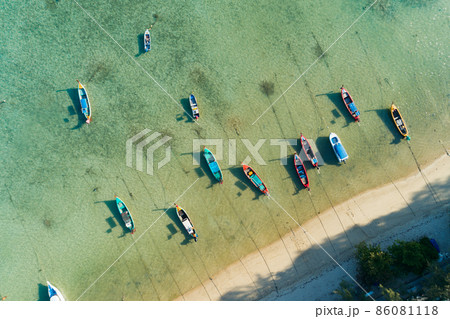 Aerial drone bird's eye view photo Top down of tropical sea with long tail fishing boats Travel boats at phuket thailand Amazing top view sea Beautiful sea surface Aerial drone bird's eye view photo Top down of tropical sea with long tail fishing boats Travel boats at phuket thailand Amazing top view sea Beautiful sea surface 86081118