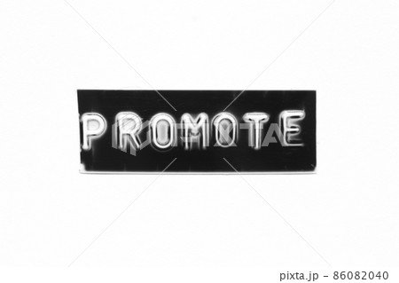 Black color banner that have embossed letter with word promote on white paper background Black color banner that have embossed letter with word promote on white paper background 86082040