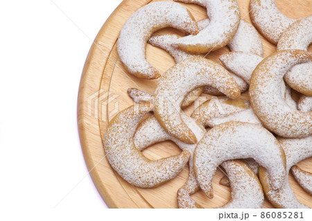 Traditional German or Austrian Vanillekipferl vanilla kipferl cookies on wooden serving board 86085281