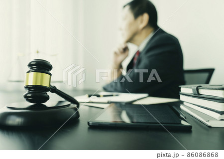 Focus on the gavel attorneys or judge sit and thinking Focus on the gavel attorneys or judge sit and thinking 86086868