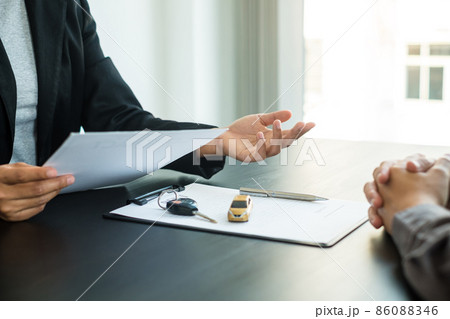 The car dealer provides advice on loans, insurance details, and car rental information, and delivers the car with the keys after the rental contract is signed 86088346