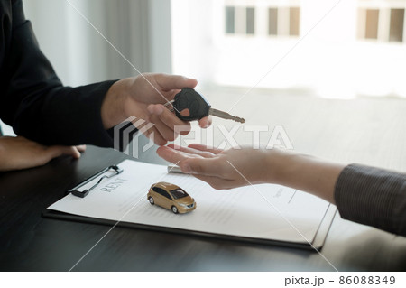 The car dealer provides advice on loans, insurance details, and car rental information, and delivers the car with the keys after the rental contract is signed 86088349